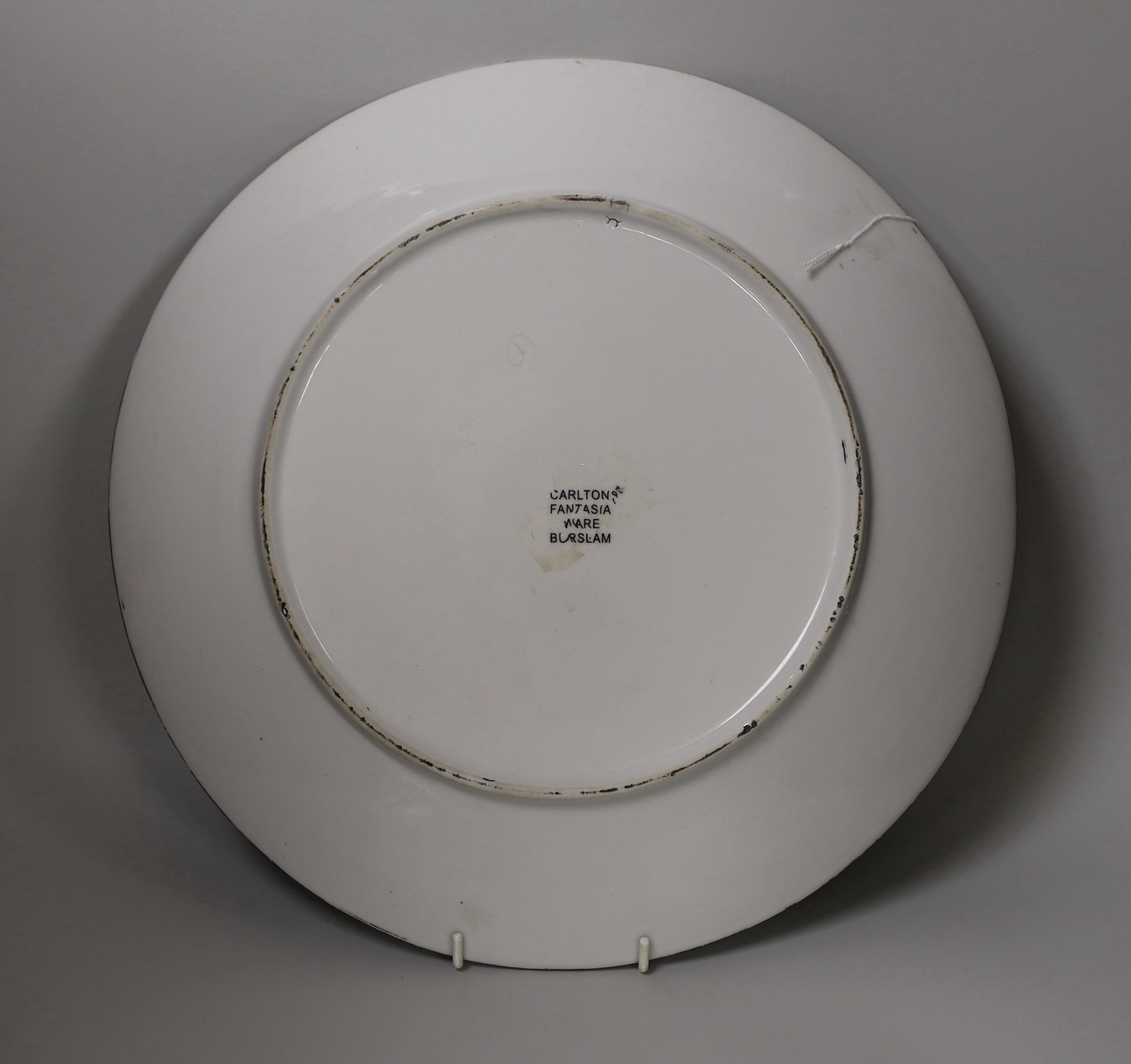 A ‘fairy’ wall plate with pseudo Carlton Fantasia Ware label to reverse, 35cm